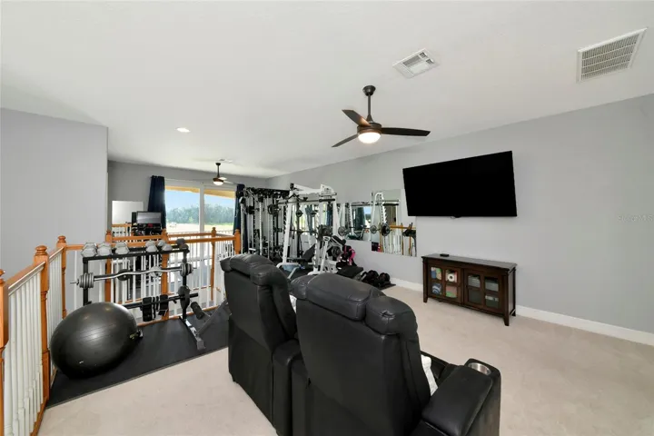 upstairs bonus room with balcony and full bath