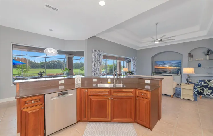 Open kitchen into the great room stainless steel appliances