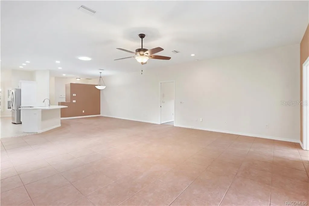 Living Room TO KITCHEN – Spacious main living area flows directly into the kitchen &amp; dining spaces, making the layout especially functional for everyday living or entertaining. Tile flooring continues throughout for a cohesive look.