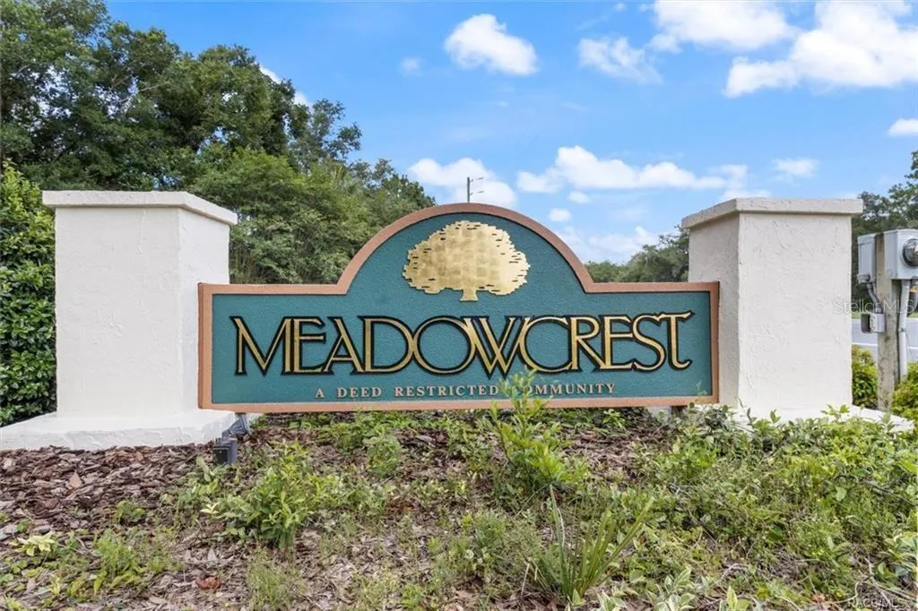 MEADOWCREST COMMUNITY – Entrance to Meadowcrest, a deed-restricted community offering an impressive collection of recreational amenities including a clubhouse, 2 pools, pickleball, tennis, shuffleboard &amp; more.