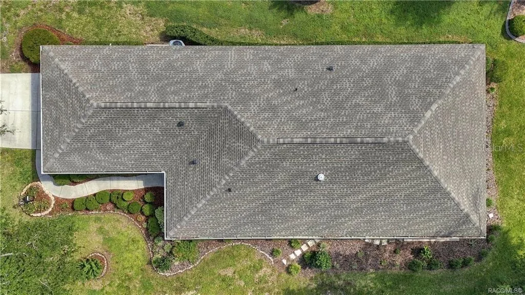 AERIAL ROOF VIEW – Direct overhead aerial providing a clear view of the home’s roofline, footprint, surrounding landscaping &amp; walkways.