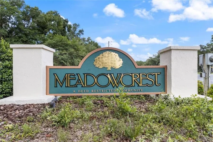MEADOWCREST COMMUNITY – Entrance to Meadowcrest, a deed-restricted community offering an impressive collection of recreational amenities including a clubhouse, 2 pools, pickleball, tennis, shuffleboard &amp; more.
