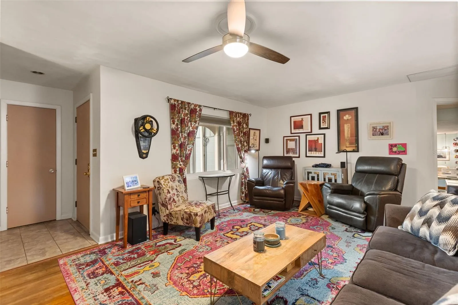 Coat closet is straight ahead and front door is to the right of it.  The living room has beautiful original hardwood floors.