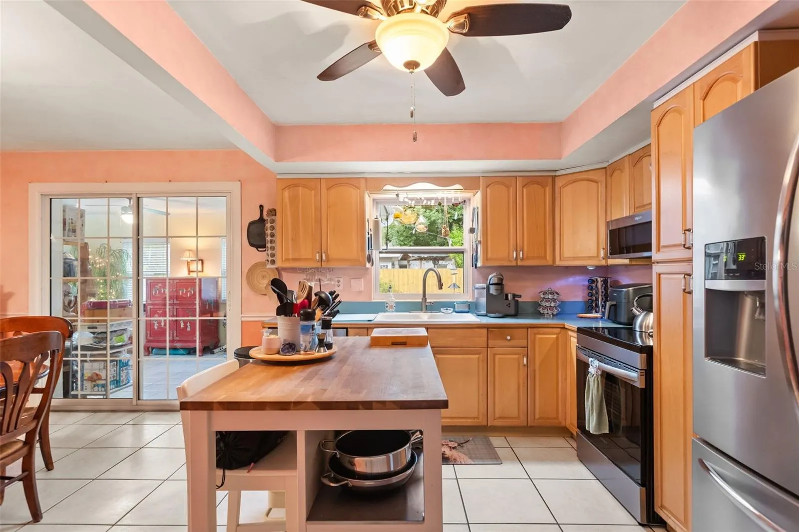 Kitchen has a window over the sink with a view of the beautiful backyard.
