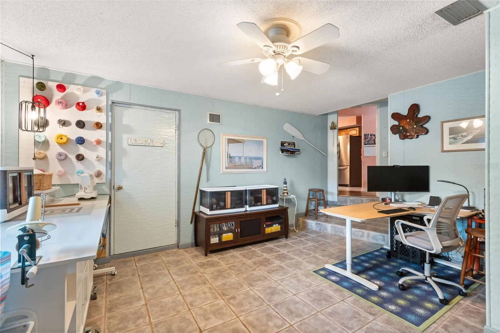 One of the downstairs bonus rooms with door to laundry/utility room.