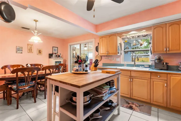 Kitchen, dining room, and sliding glass door to one of the bonus rooms.