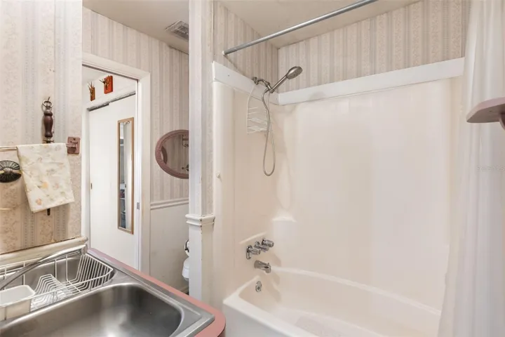 Upstairs bathroom with a kitchen sink for multigenerational living.