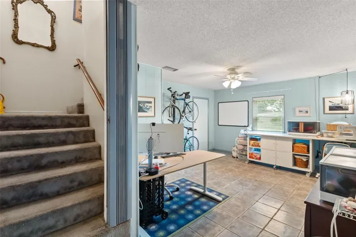 Stairwell to upstairs and one of the downstairs bonus rooms.