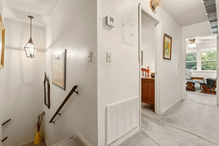 Upstairs has two bedrooms, a living area, butler pantry, and a bathroom.