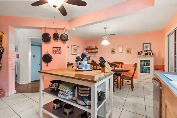 Kitchen is open to the dining room.  The doorway leads to a bonus room. The far door leads to the upstairs.