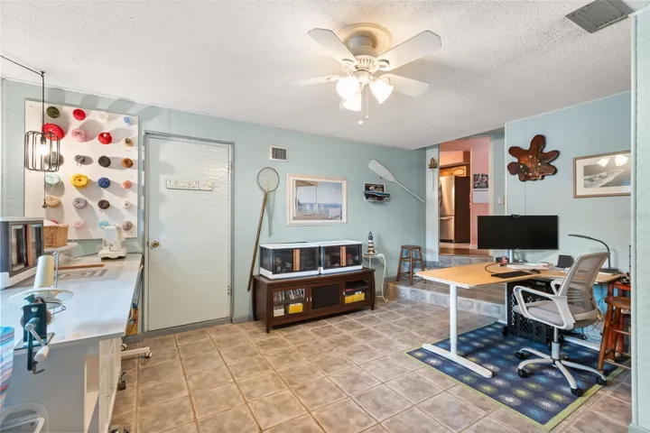 One of the downstairs bonus rooms with door to laundry/utility room.