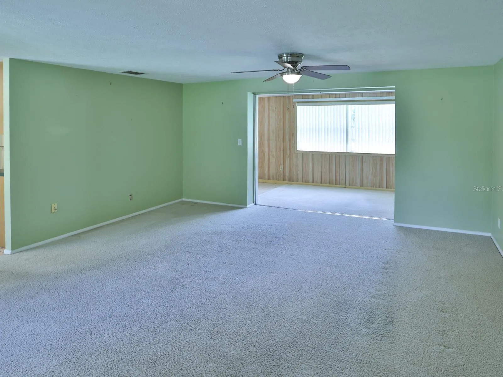 Living room with view of the family room.