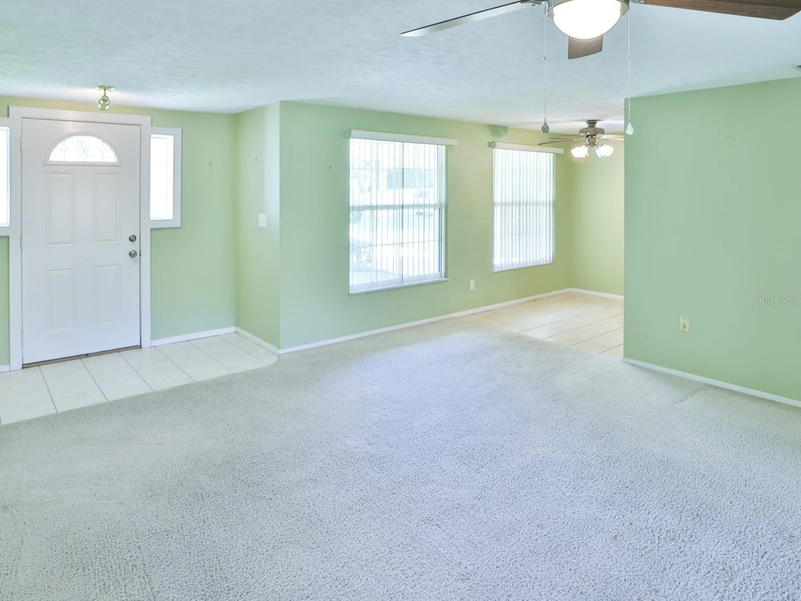 Living room with view of the dining room.