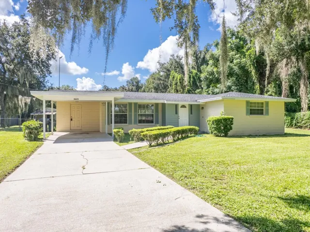 Front of the home with a one car carport.