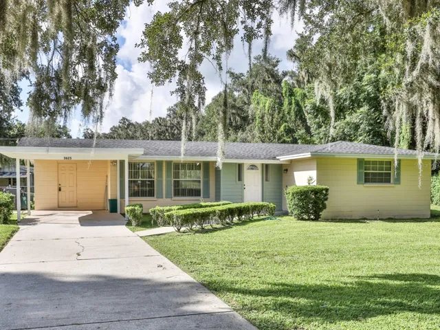 Front of the home with a one car carport.
