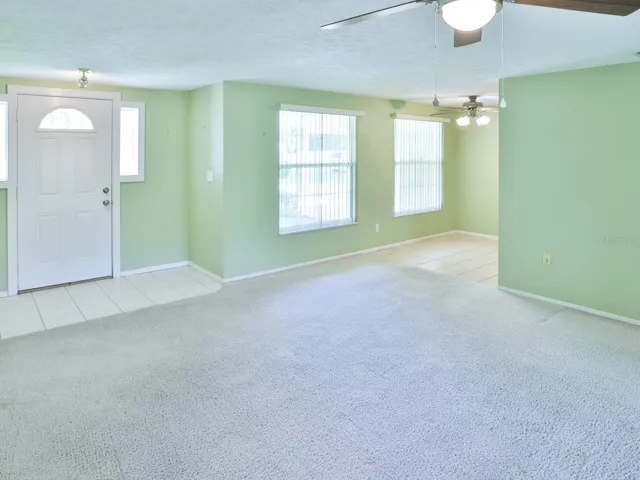 Living room with view of the dining room.