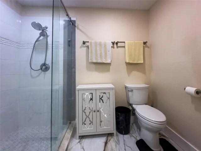 Master bath shower with custom glass and heated floors.