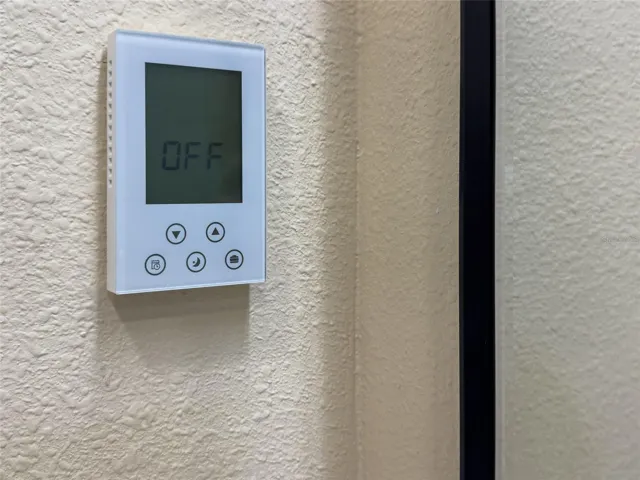 Wall unit controls bathroom heated floors.  One control on each bathroom wall.