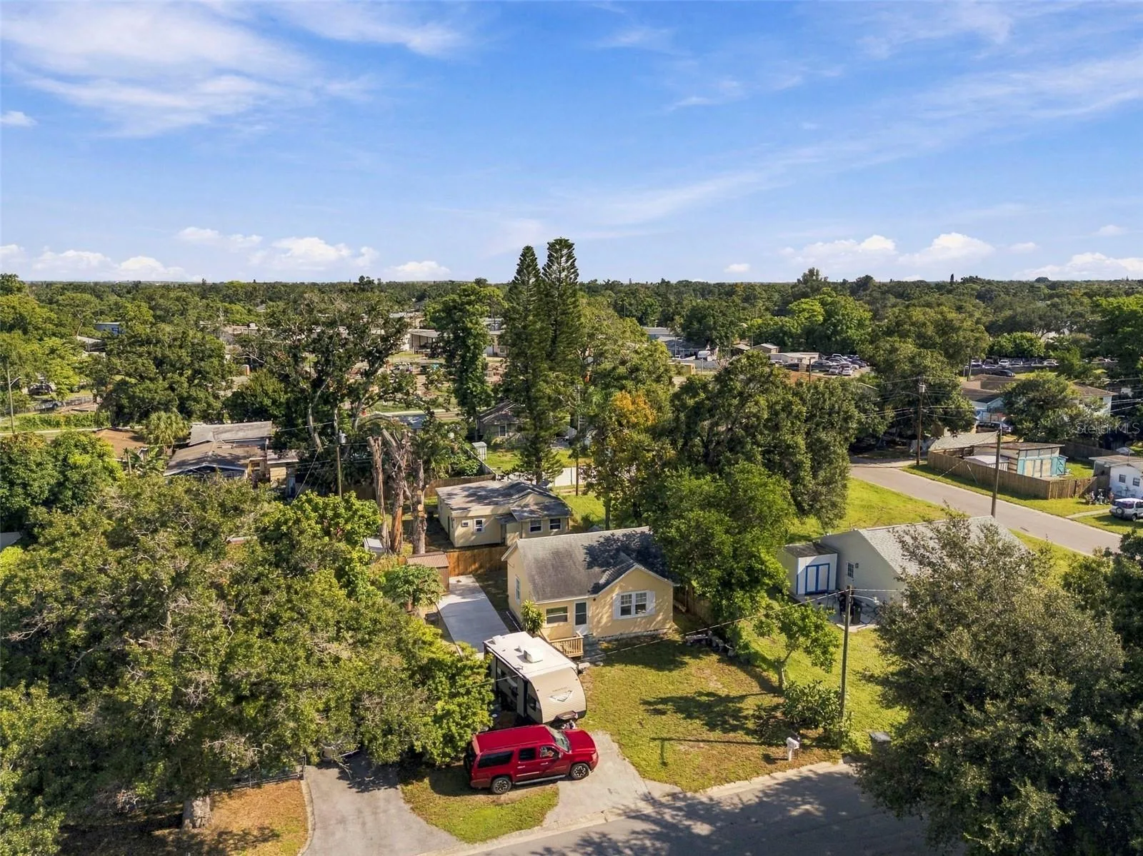 Aerial view of the property and surrounding area