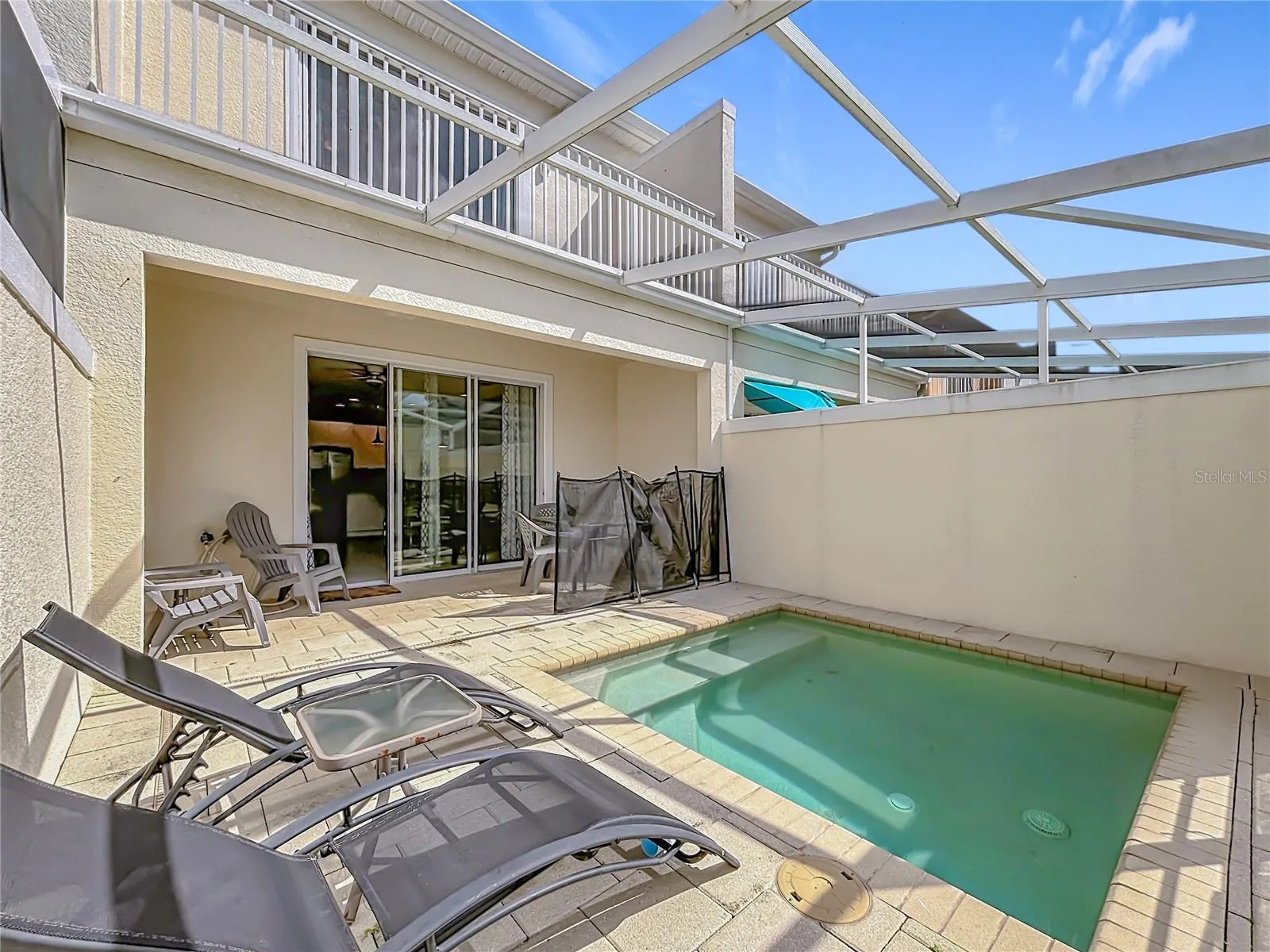Screened Pool Area — Fully screened private pool with lounge space and direct access from the main living area.