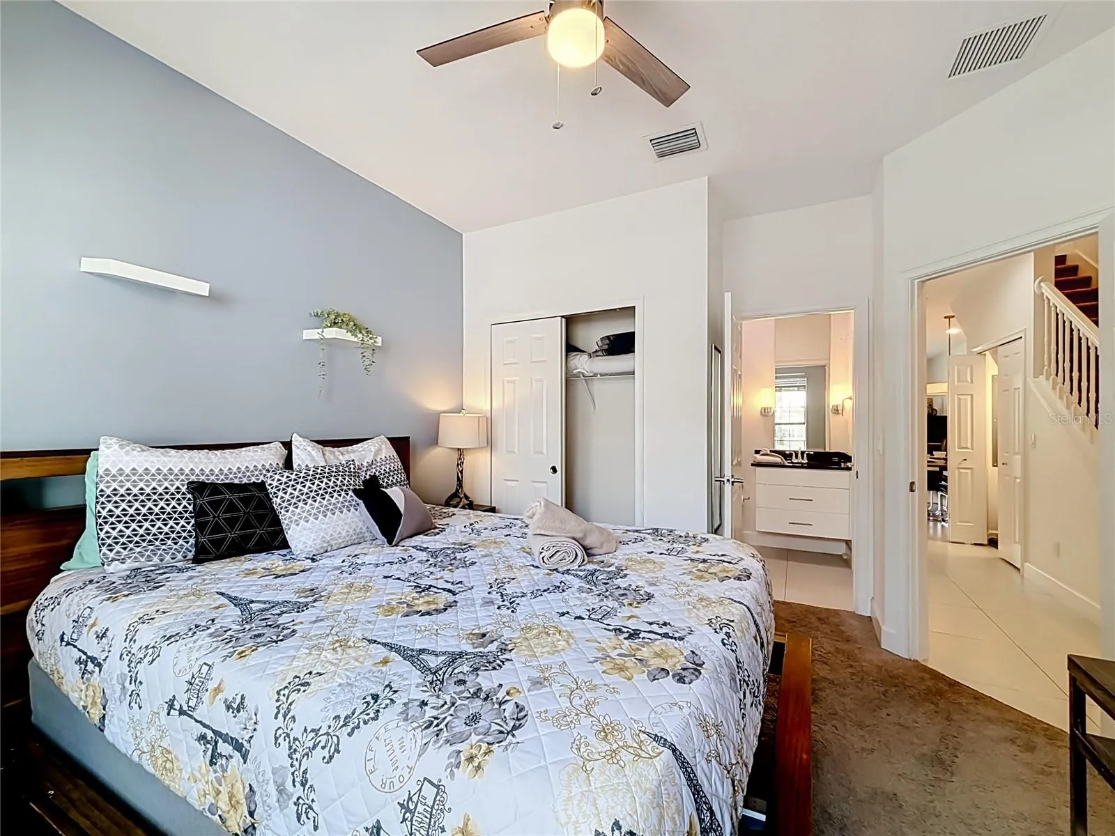Downstairs Bedroom — Spacious main-level bedroom with its own full en-suite bathroom, ideal for guests or multigenerational stays.