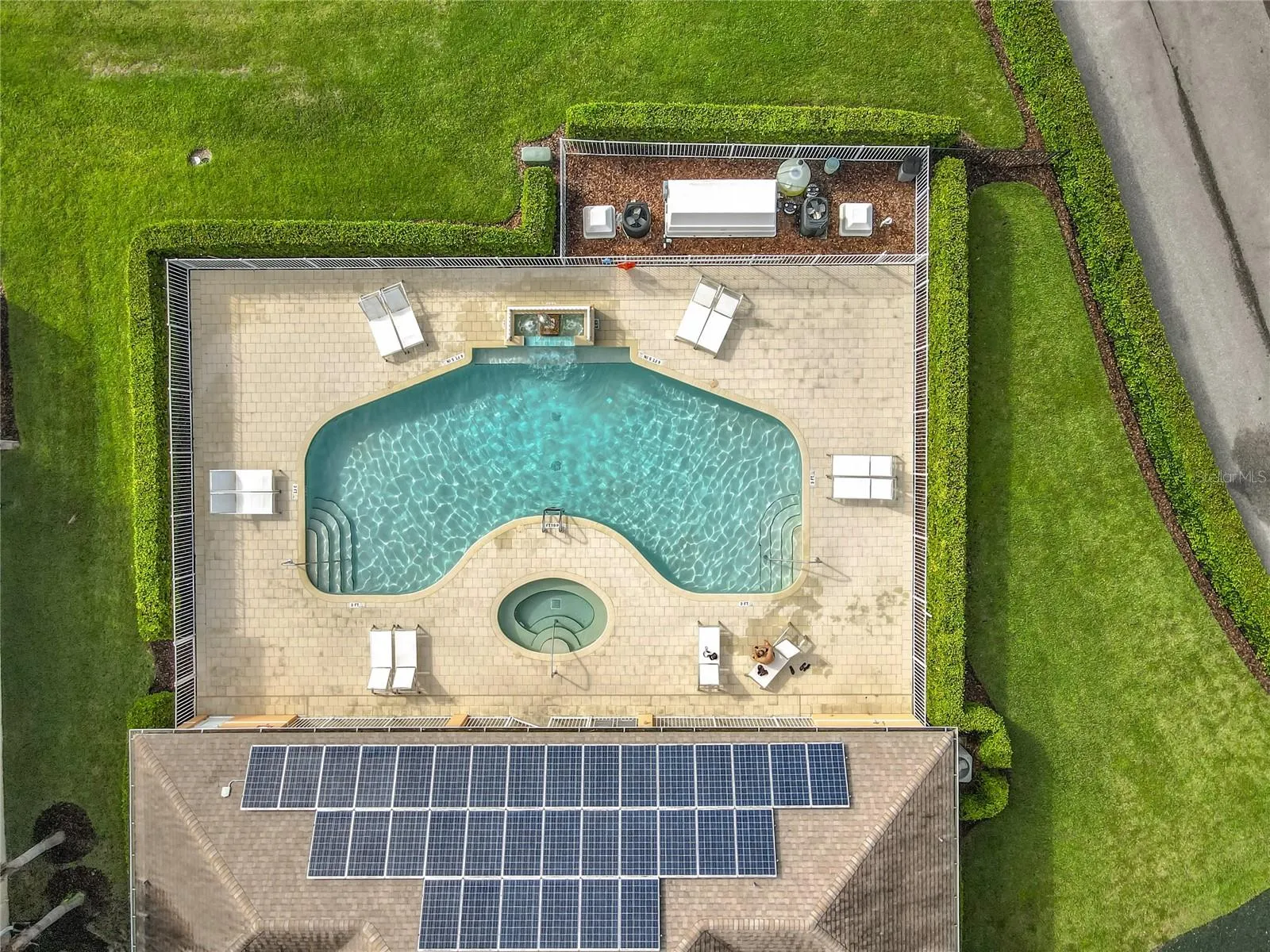 Community Pool — Aerial view of the community pool area, providing another option for relaxing and enjoying the Florida sunshine.