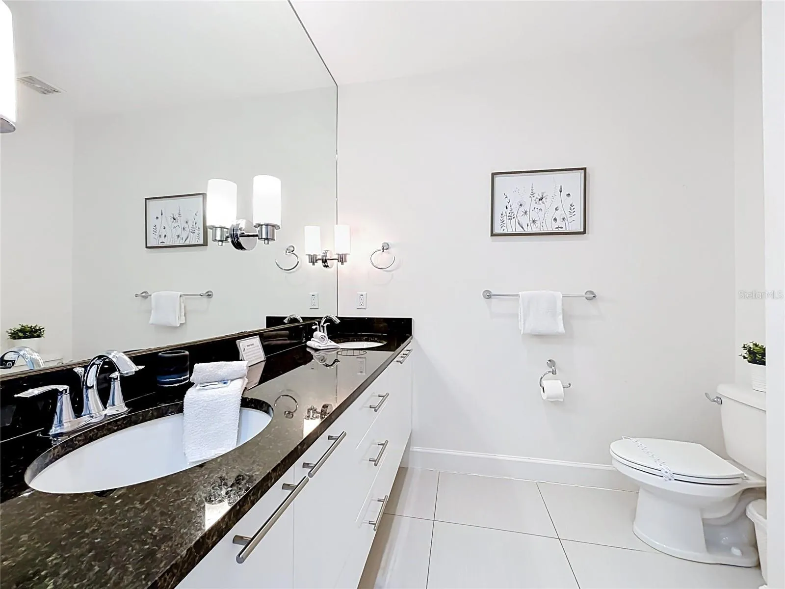 Primary Bathroom — Private primary bath with dual-sink vanity, generous counter space, and clean contemporary finishes.