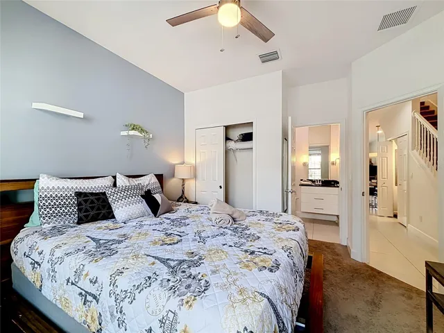 Downstairs Bedroom — Spacious main-level bedroom with its own full en-suite bathroom, ideal for guests or multigenerational stays.