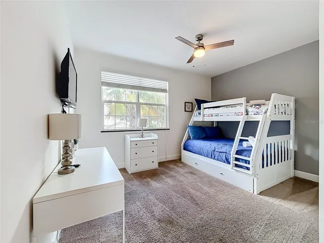 Bedroom 3 — Bright upstairs guest bedroom with bunk beds, making excellent use of the space for families and vacation rentals.