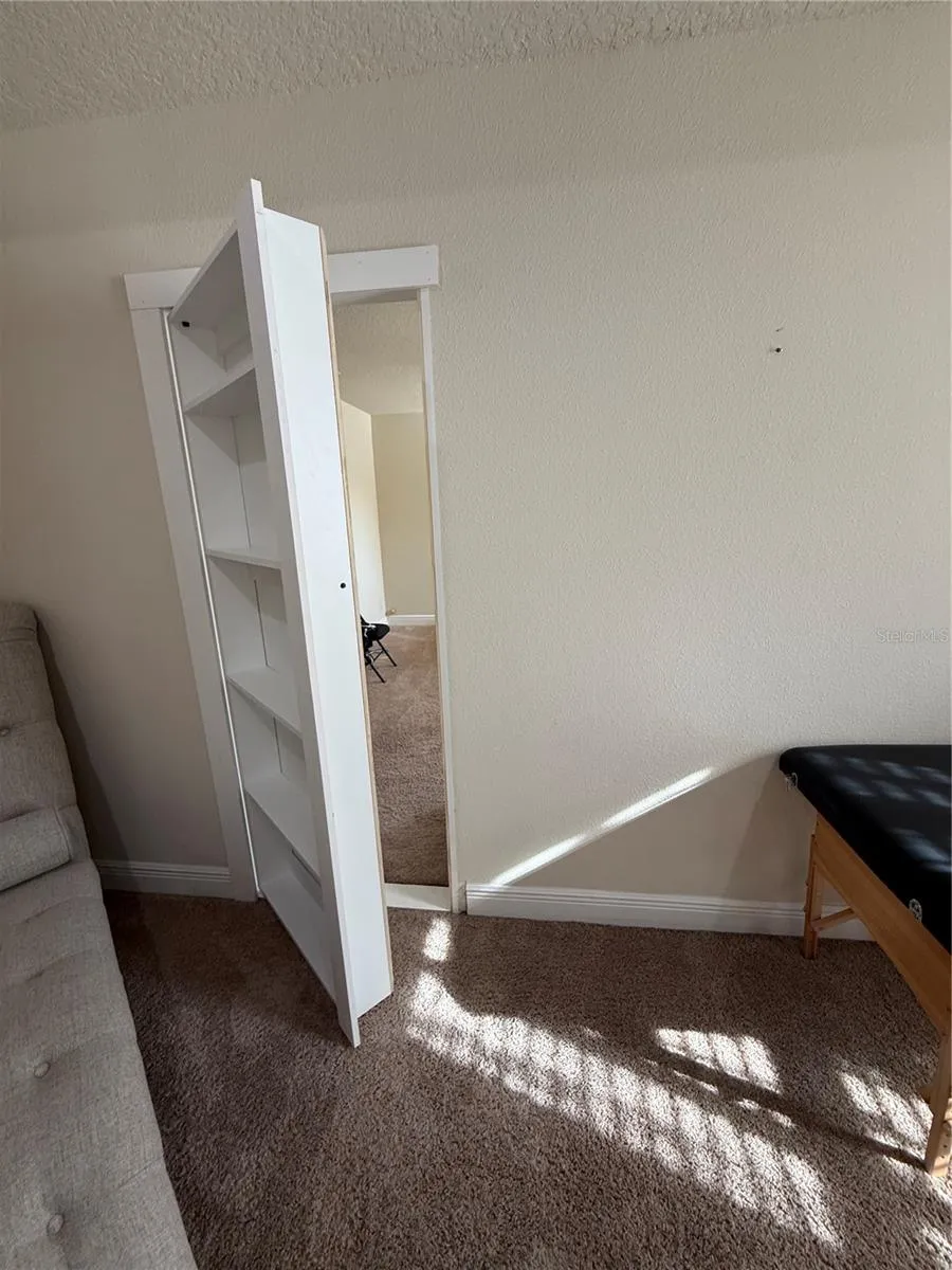 Hidden Bookshelf in Primary Bedroom leading to Bedroom 4