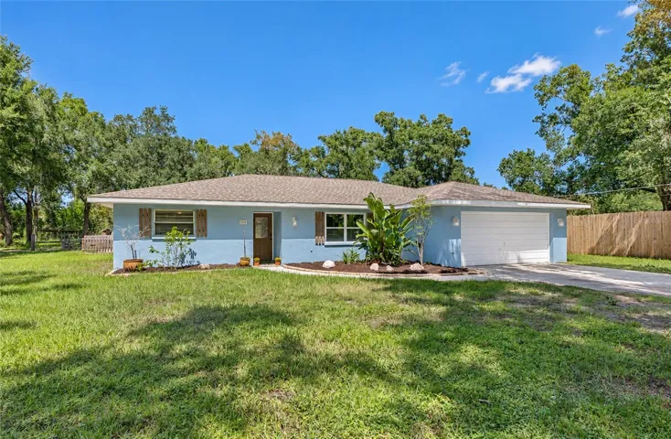 Front of this acreage home in town