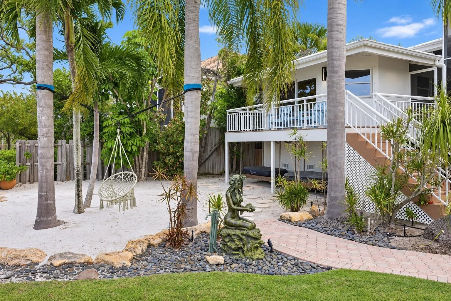 Private beach sand area and entrance to the detached guest suite
