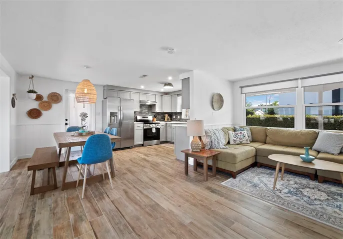 Completely remodeled with a new kitchen, new appliances and beautiful wood look tile throughout the home.