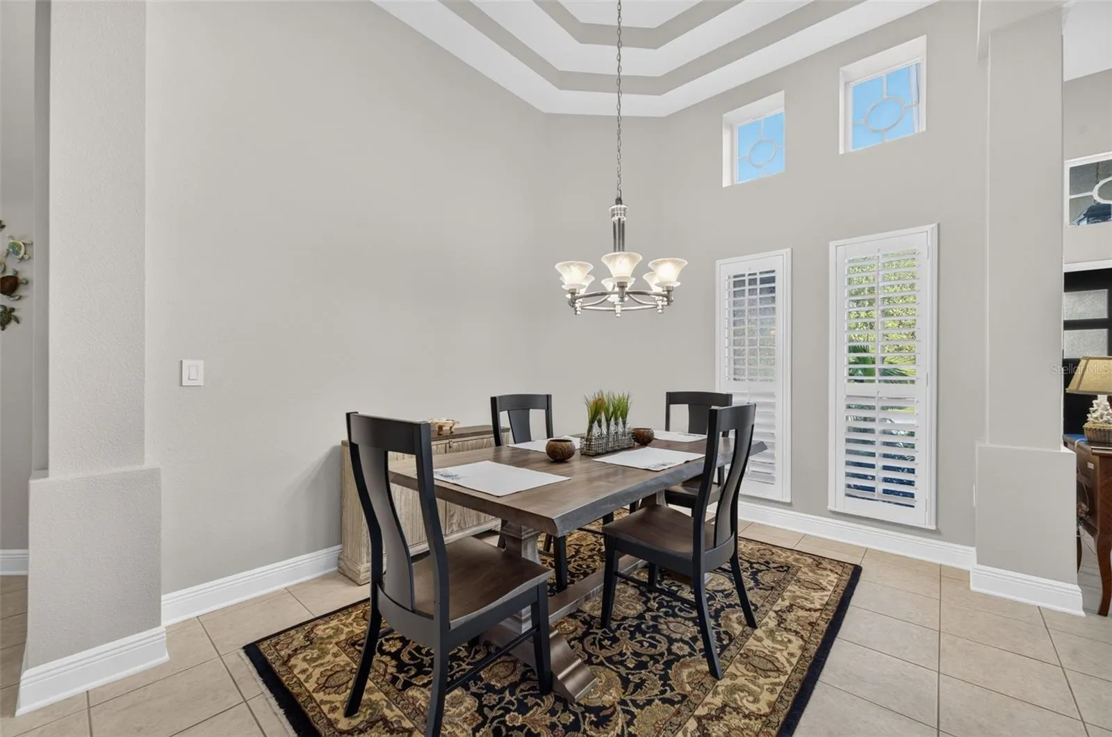 Formal Dining Room with Double Trey Ceiling &amp; Plantation Blinds Throughout