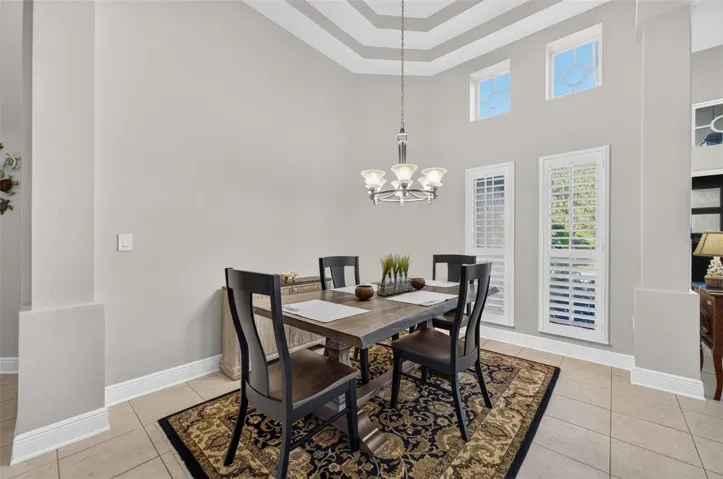 Formal Dining Room with Double Trey Ceiling &amp; Plantation Blinds Throughout