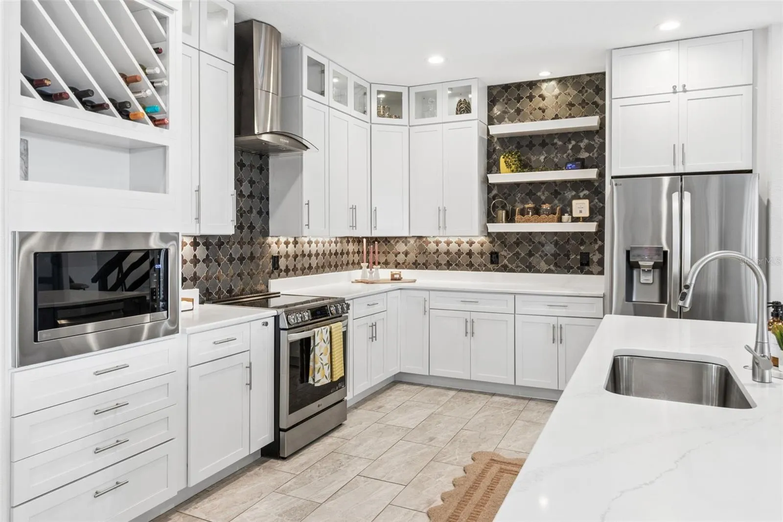 Stainless steel appliances include brand new refrigerator and microwave