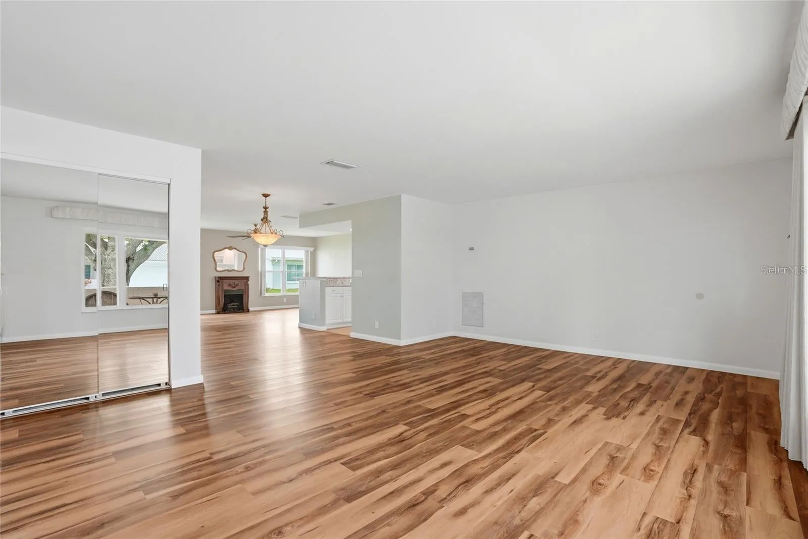 Notice the elegant luxury vinyl flooring.