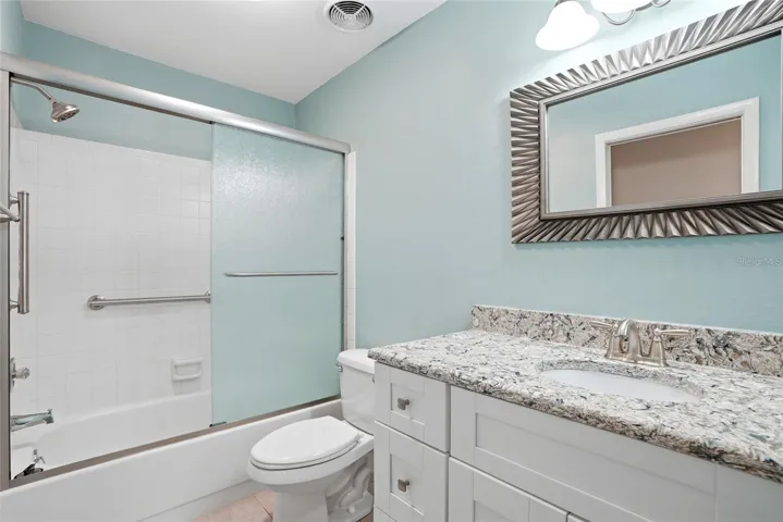 Guest bathroom. Notice how nice the same corian countertops are in the bathrooms as well.