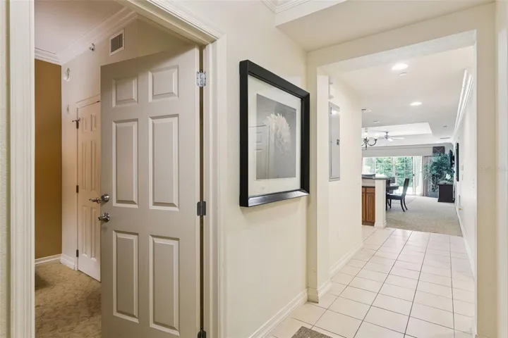 Entry Foyer: Welcoming entryway featuring neutral tile flooring, crisp trim work, and direct sightlines into the open-concept living area.