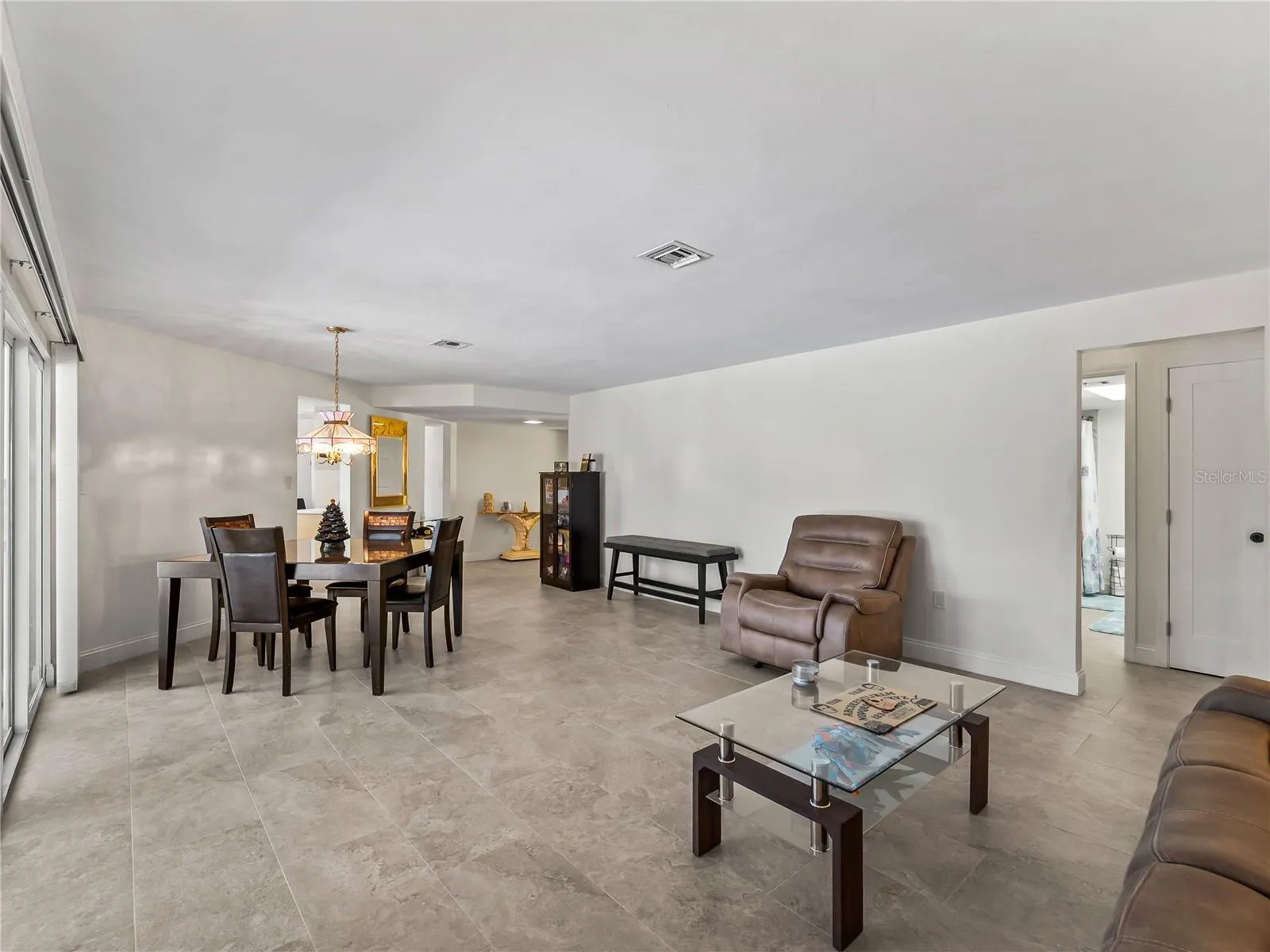 DiningLiving_2903rdStreet_BonitaSprings_NaturalLight_Corner.jpg