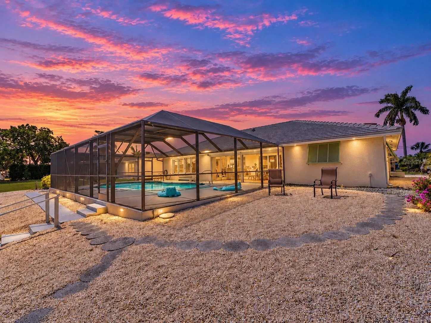 RearExterior_2903rdStreet_BonitaSprings_ScreenEnclosure_Twilight.jpg
