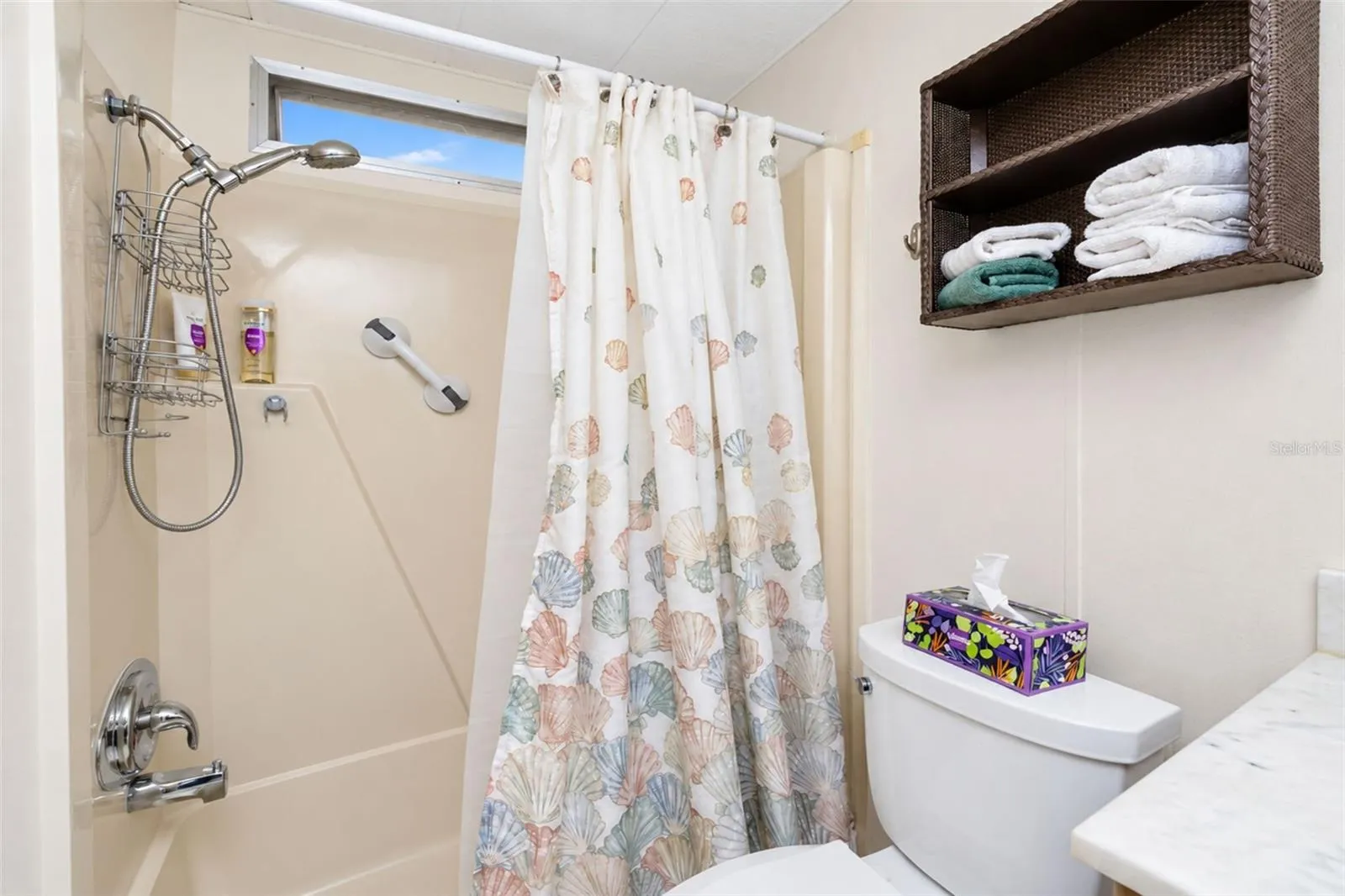 Guest bath has a Combo tub/shower and tiled flooring
