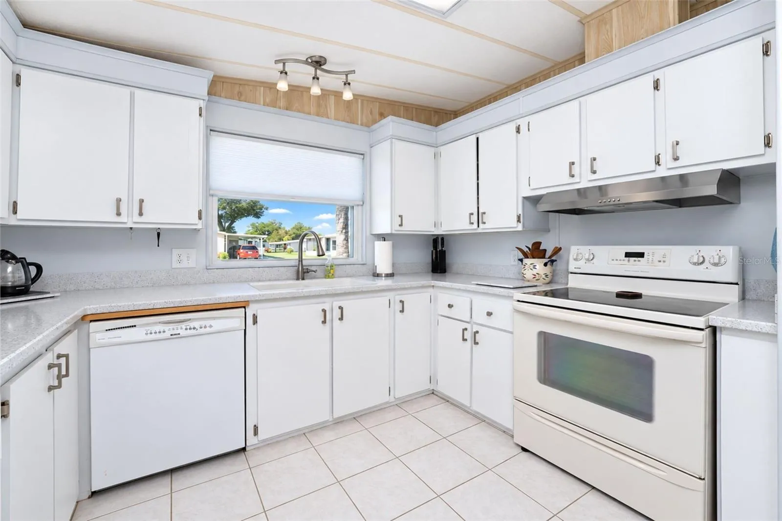 Kenmore smooth top stove, Kenmore dishwaher, and Kenmore double door refrigerator are included.