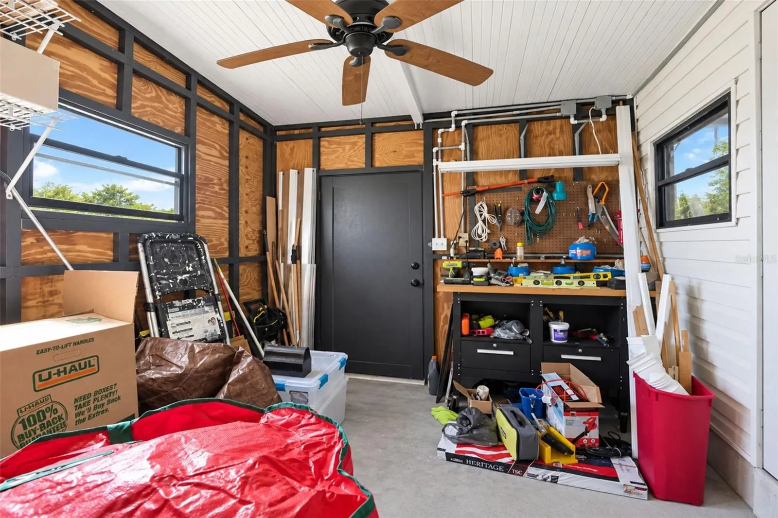The shed/workshop just off the laundry room provides even more storage!