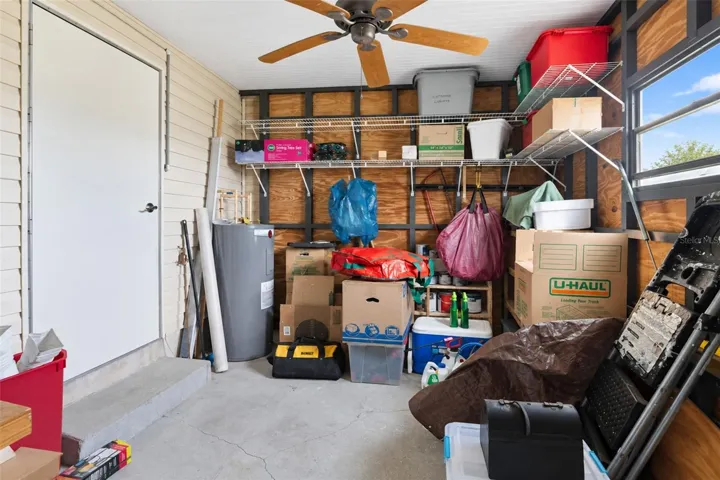 The shed houses the water heater and has a door to the exterior of the home.