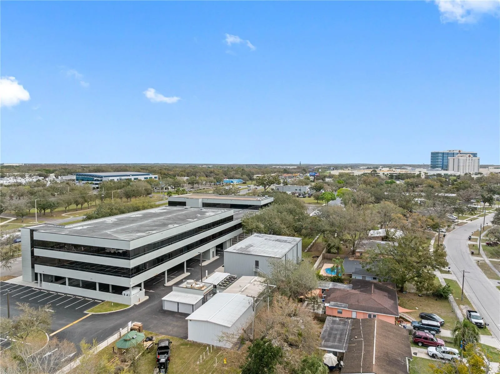 SW corner of West Annex showing under building parking entrance and available Warehouse/Office