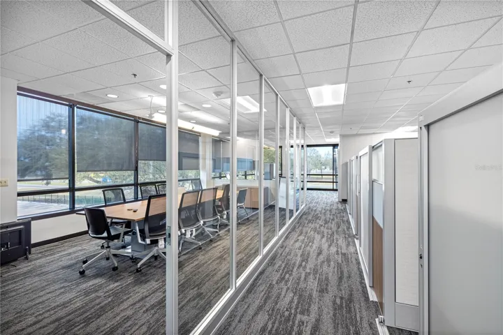 Multiple departmental conference rooms throughout.
