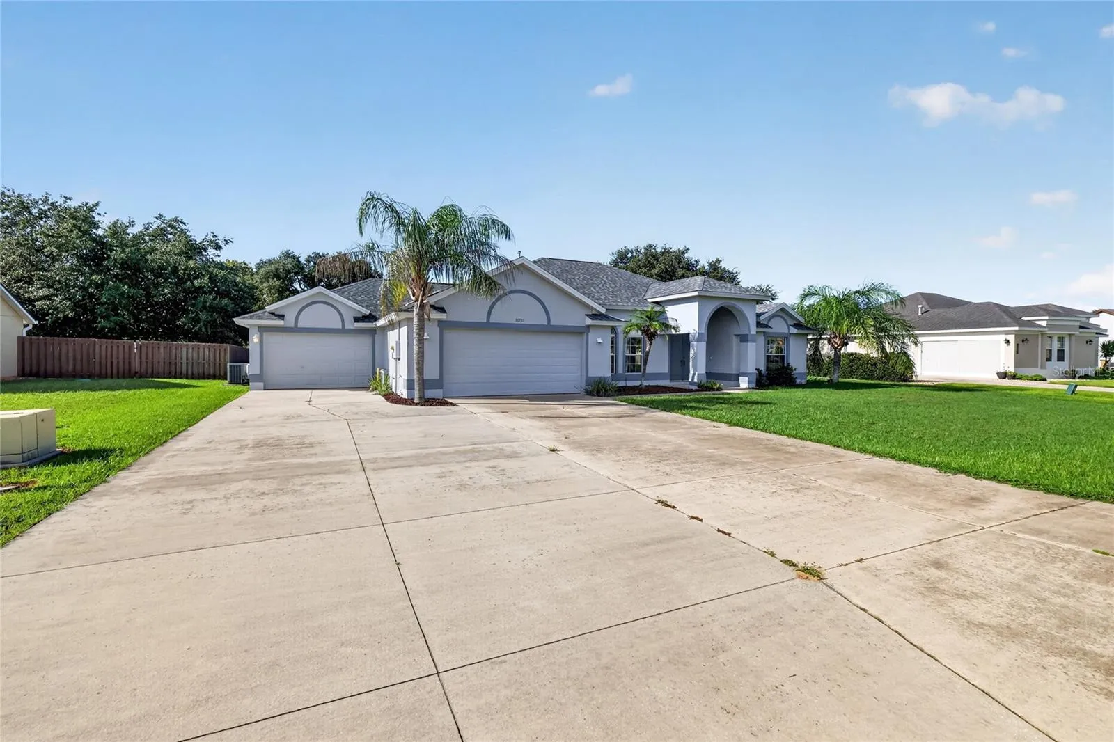 ituated on a .37-acre lot in Biscayne Heights, this home features two oversized garages and an extended driveway.