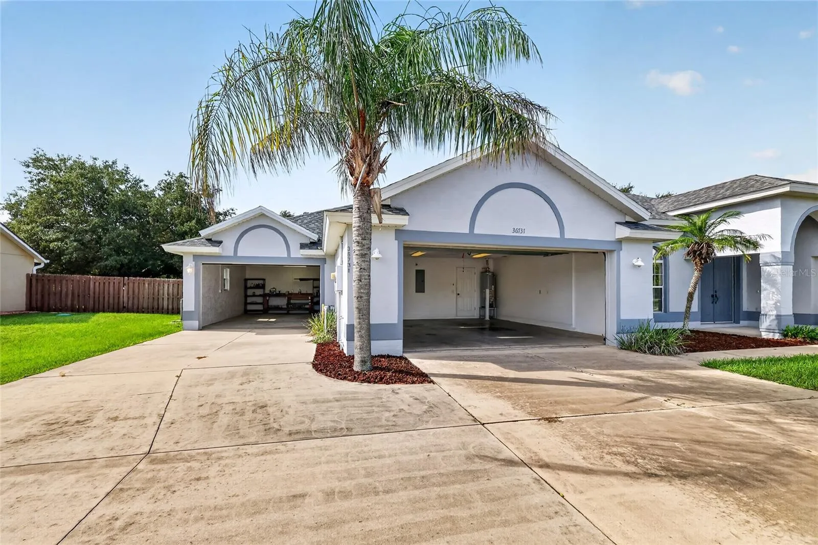 Two attached garages offer more than 900 square feet of combined space for vehicles, a workshop, and additional storage.