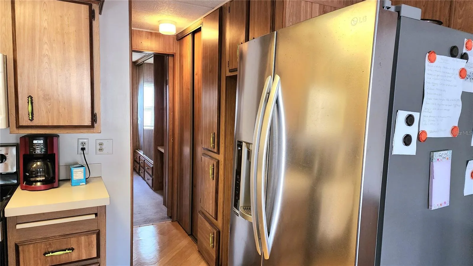 Kitchen and hallway to bed and bath